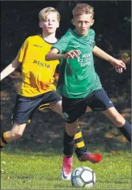  ?? Pictures: Andy Jones FM4934629, FM4934627 Buy these pictures from kentonline.co.uk ?? Maidstone United Youth under-14s’ Joel Pickard is tightly marked by Vinters Green, and, right, Green’s Reilly Connor and Stones’ Hayden Sands