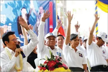  ?? PHA LINA ?? Opposition leader Kem Sokha and other members of the opposition CNRP vote in favour of new leadership at an extraordin­ary congress earlier this month in Phnom Penh.