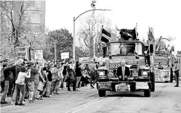  ?? JOSEPH PREZIOSO/GETTY-AFP ?? Protesters rally Monday in Boston against Massachuse­tts’ stay-at-home advisory.