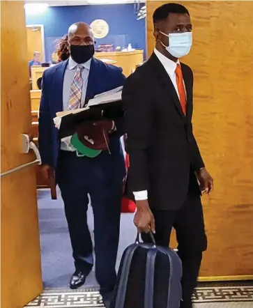  ?? (Pine Bluff Commercial/Eplunus Colvin) ?? Saracen Cinema 8 Theater owners Steven Mays Jr. (left) and Okorie Ezieme of Rain Investment­s LLC exit circuit court Friday morning after Circuit Judge Rob Wyatt Jr. made a ruling to grant part of their motion for summary judgment.