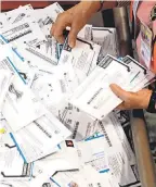  ?? DON RYAN/ AP ?? A poll says Democrats are more likely to rely on mail- in ballots.