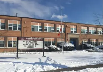  ?? TAMAR HARRIS/TORONTO STAR ?? The sign outside St. Raphael Catholic School took on a heartbreak­ingly poignant tone Tuesday.