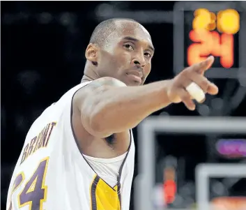  ?? MARK J. TERRILL/ THE ASSOCIATED PRESS FILES ?? In this June 7, 2009, file photo, Los Angeles Lakers guard Kobe Bryant points to a player behind him after making a basket in the closing seconds against the Orlando Magic in Game 2 of the NBA Finals, in Los Angeles. After two decades spent dazzling...