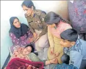  ??  ?? ■ Relatives of head constable Naseer Ahmed at Dodasan Bala village in Rajouri on Saturday. HT PHOTO