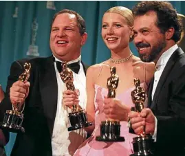  ?? —NYT ?? Harvey Weinstein (left) with one of his victims, actor Gwynneth Paltrow (center), as they receive Oscars for the film “Shakespear­e in Love” in 1999.