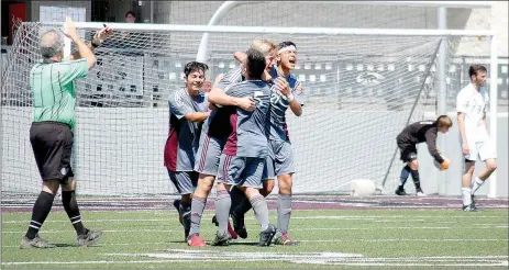  ?? Graham Thomas/Herald-Leader ?? Siloam Springs boys soccer players, from left, Jose Serrano, Jack Bos, Aric Lee and Christian Marroquin celebrate after Bos scored with 2:37 left in the match to give the Panthers a 2-1 victory over Holland Hall (Okla.) on Saturday in the semifinals of...