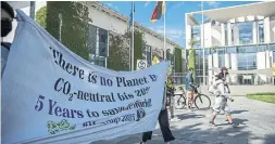  ?? MAJA HITIJ GETTY IMAGES ?? Supporters of the climate change group Extinction Rebellion marching in Berlin to launch a summer protest campaign. Their message: “There is no Planet B.”