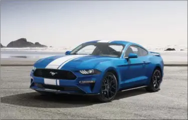  ?? FORD VIA THE ASSOCIATED PRESS ?? This undated photo provided by Ford shows a 2019 Ford Mustang. This entry-level Mustang also comes standard with a surprising amount of racy hardware.