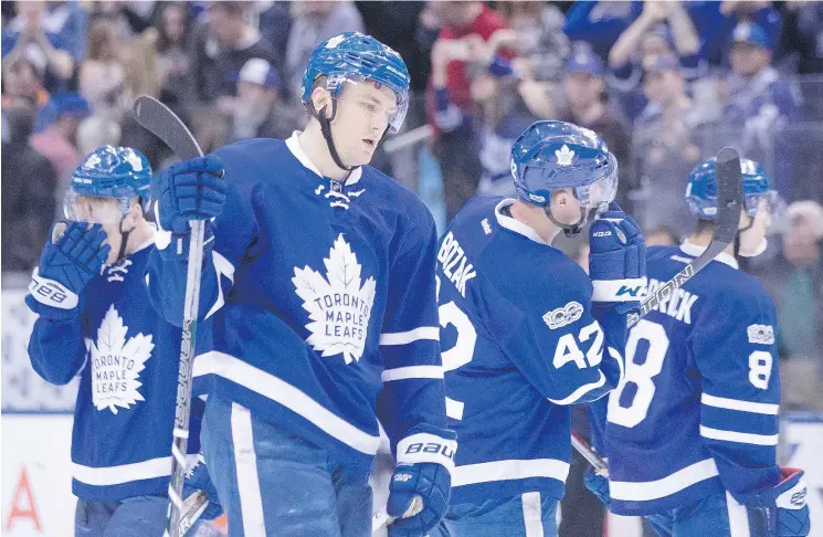  ?? — THE CANADIAN PRESS ?? James van Riemsdyk and his Maple Leafs teammates react after losing to Columbus on Sunday, setting up an opening round series against Washington.