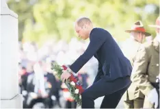  ??  ?? William, lays a wreath during an Anzac Day service at the Auckland War Memorial, in Auckland, New Zealand. — Reuters photo