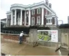  ??  ?? Workers are finishing the new walkway around the mansion at the Hunter Museum of Art and are preparing to make repairs to the columns on the historic 1904 mansion.