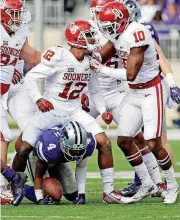 ?? [PHOTO ?? Will Johnson (12) celebrates a tackle in the 2015 game at Kansas State. Johnson is returning Saturday against Iowa State after missing two games due to a head injury.
