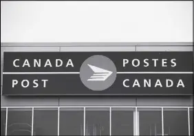  ?? CP PHOTO ?? The Canada Post logo is seen on the outside the company’s Pacific Processing Centre in Richmond, B.C.