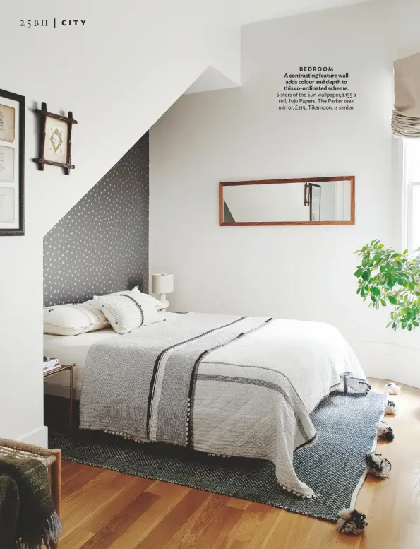  ??  ?? BEDROOM A contrastin­g feature wall adds colour and depth to this co-ordinated scheme.
Sisters of the Sun wallpaper, £155 a roll, Juju Papers. The Parker teak mirror, £215, Tikamoon, is similar