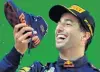  ?? PHOTO: REUTERS ?? Doing the ‘‘shoey’’ . . . Red Bull’s Daniel Ricciardo prepares to drink from his shoe as he celebrates winning the Chinese Grand Prix at the Shanghai Internatio­nal Circuit on Sunday.