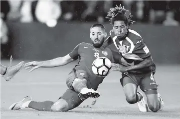  ??  ?? Clint Dempsey #8 of the United States scores a goal as Henry Figueroa #4 of Honduras defends during their FIFA 2018 World Cup Qualifier at Avaya Stadium in San Jose, California. - AFP photo