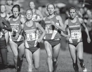  ?? NWA Media/JASON IVESTER ?? Arkansas runners Shannon Klenke (21), Dominique Scott (26), Grace Heymsfield (20) and Diane Robison (24) run in the women’s collegiate 5K on Saturday during the 26th annual Chile Pepper Cross Country Festival at Agri Park in Fayettevil­le. Scott won...