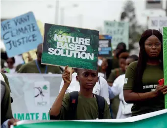  ?? AP ?? Protesters march in Lagos as part of a day of worldwide demonstrat­ions calling for action on climate change.