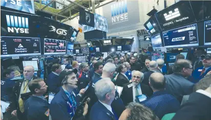  ?? (Stephen Yang/Reuters) ?? TRADERS GATHER for Keane Group’s IPO on the floor of the New York Stock Exchange last Friday. In the days ahead of the inaugurati­on, senior executives from Morgan Stanley, Delta Air Lines and other major US corporatio­ns said the Trump White House has...