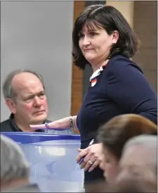  ?? CHRIS CHRISTO — BOSTON HERALD ?? Amy Carnevale places her ballot into a box during voting at the Republican Committee meeting in late January.
