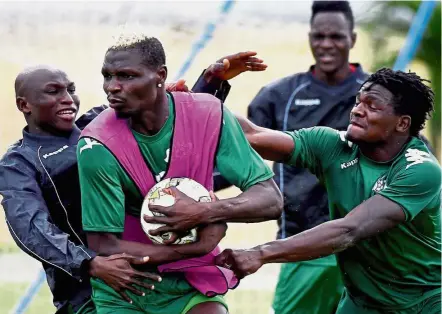  ??  ?? Time to relax: Burkina Faso’s Aristide Bance (second from left) and team-mates fooling around during yesterday’s training session ahead their African Nations Cup semi-final match against Egypt in Gabon today. — AFP