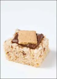  ?? TNS/Los Angeles Times/MARIAH TAUGER ?? Campfire Marshmallo­w Bars become S’mores Bars with the addition of milk chocolate and a graham cracker.
