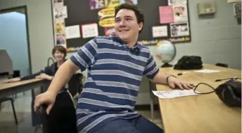  ?? LUCAS OLENIUK/TORONTO STAR ?? Grade 10 student Bradley Gray-Hall sits in Room 150. The Streetsvil­le Secondary School program integrates high-functionin­g autistic teens into a mainstream high school by helping them with social and coping skills.