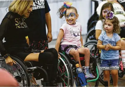  ?? Houston Chronicle file ?? Honor Tinsley smiles as she dances with Auti Angel during a FreeStyle Dance Workshop at the Abilities Expo.