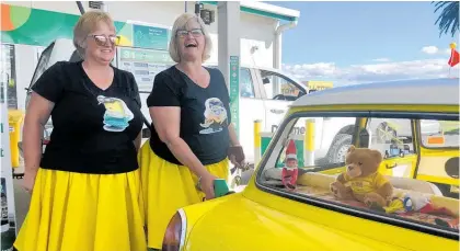  ?? Photo / Alison Smith ?? Allison Eagles and Sherrilyn Cook fill up their Elf in Thames at the Repco Beach Hop 2021.