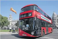  ?? AFP ?? A large balloon depicting London Mayor Sadiq Khan floats over an iconic London red bus in central London. —
