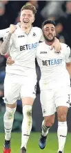  ??  ?? Alfie Mawson (left) celebrates his goal with team-mate Neil Taylor.