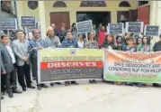  ??  ?? Congress members protest in Meghalaya on Friday over the government formation in Karnataka; (right) Assam Pradesh Congress Committee observe ‘Save Democracy Day’ in Guwahati.