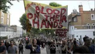  ??  ?? Protestors take to London’s streets after the Grenfell Towers tragedy.