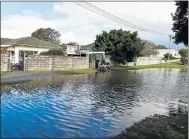  ?? Picture: EUGENE COETZEE ?? UNDER WATER: Three properties were affected when a stretch of 6th Avenue in Newton Park flooded after heavy rains