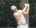  ?? CHUCK BURTON AP ?? Lucas Glover, teeing off on the second hole Saturday, shares the Wyndham Championsh­ip lead after shooting 62.