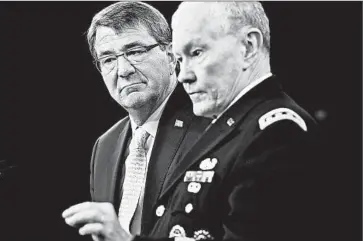  ?? ALEX WONG/GETTY ?? Defense chief Ash Carter, left, and Joint Chiefs Chairman Martin Dempsey both downplay the so-called military option.