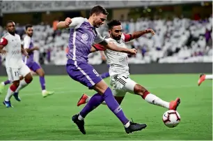  ?? Supplied photo ?? Al Ain and Al Jazira players vie for the ball during the Arabian Gulf League match at the Hazza bin Zayed Stadium in Al Ain on Saturday night. —