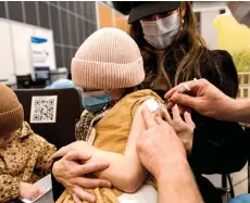  ?? — AFP photo ?? A child, age 7, receives the Pfizer-BioNTech Covid-19 vaccine for children in Montreal, Quebec.