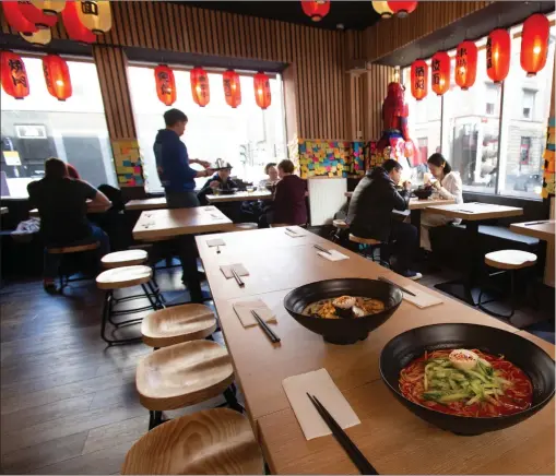  ??  ?? Ramen Ramen on Bath Street, Glasgow, has a warm, street-food vibe Photograph: Colin Mearns