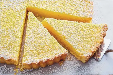  ?? SCOTT SUCHMAN/FOR THE WASHINGTON POST ?? It’s rare that less effort delivers a better outcome, but this whole lemon tart is proof-positive such a thing exists.