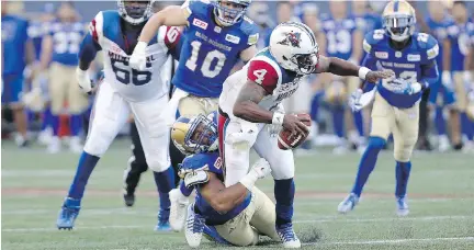  ?? TREVOR HAGAN/THE CANADIAN PRESS ?? The Blue Bombers’ Jackson Jeffcoat sacks Als quarterbac­k Darian Durant during the first half in Winnipeg.