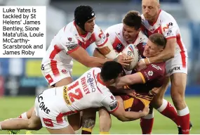  ??  ?? Luke Yates is tackled by St Helens’ James Bentley, Sione Mata’utia, Louie McCarthySc­arsbrook and James Roby