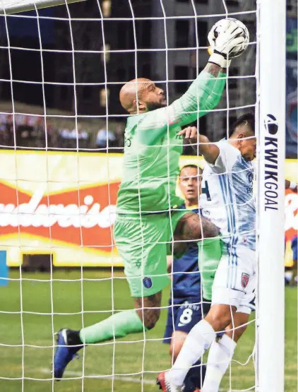  ?? ARIEL COBBERT/THE COMMERCIAL APPEAL ?? Memphis 901 FC keeper Tim Howard (1) makes a save on a shot during a game at Autozone Park on March 7. Memphis lost to Indy Eleven 4-2 in opening game of USL Championsh­ip season.