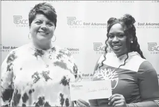  ?? Submitted Photo ?? Tabitha Thomas, right, of Wynne has been awarded the EACC Foundation’s Non-Traditiona­l Student Scholarshi­p for Fall 2021. This scholarshi­p is awarded to a full-time sophomore student who is 25 years or older. Thomas is currently enrolled in EACC’s Associate of Science in Education degree program with focus on Childcare. She plans to continue her education in childcare. Niki Jones, left, EACC Director of Developmen­t presents the scholarshi­p to Thomas.