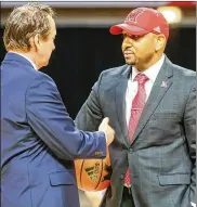  ?? GREG LYNCH / STAFF ?? New Miami RedHawks coach Jack Owens (right, with Athletic Director David Sayler) has drawn on his roots in Indiana to draw basketball players from that state to Oxford.