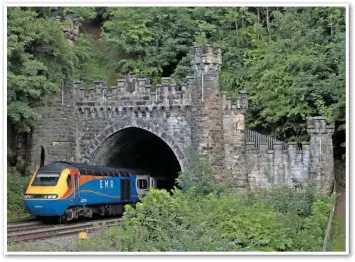  ?? PAUL ROBERTSON. ?? East Midlands Railway 43067 forms the rear of the 1845 Nottingham-Leicester on July 26, as it disappears into Red Hill Tunnel on the Nottingham­shire-Derbyshire border. Originally a single bore, a twin tunnel was added following the widening of the Midland Main Line in 1891-93. It is sandwiched between twin viaducts over the River Trent to the north and East Midlands Parkway station and Ratcliffe-on-Soar power station to its immediate south.