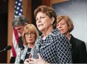  ?? J. Scott Applewhite / Associated Press ?? Sen. Jeanne Shaheen, D-N.H., joined by fellow senators, discusses the implicatio­ns of the rollback of the Affordable Care Act.