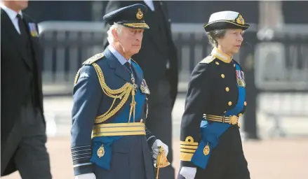  ?? DANIEL LEAL/POOL ?? Britain’s King Charles III and Princess Anne walk behind their mother’s coffin Wednesday in a procession to Westminste­r Hall in London.