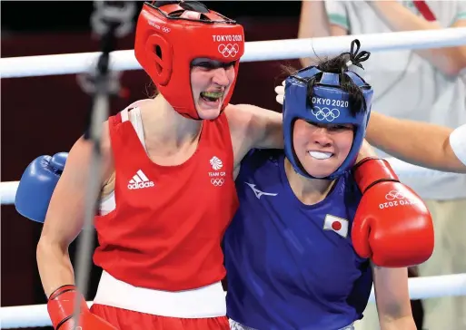  ?? PA Wire ?? Macclesfie­ld’s Karriss Artingstal­l, left, reacts after losing the Women’s Feather (54-57kg) semi-final, earning her the bronze medal at the Kokugikan Arena during the Tokyo 2020 Olympic Games in Japan