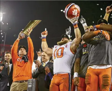  ?? LOREN ELLIOT / TAMPA BAY TIMES FILE ?? Over the past three seasons, Clemson coach Dabo Swinney (left) is 25-2 against league teams, with 18 wins by double-digit margins and the losses coming by a combined four points.